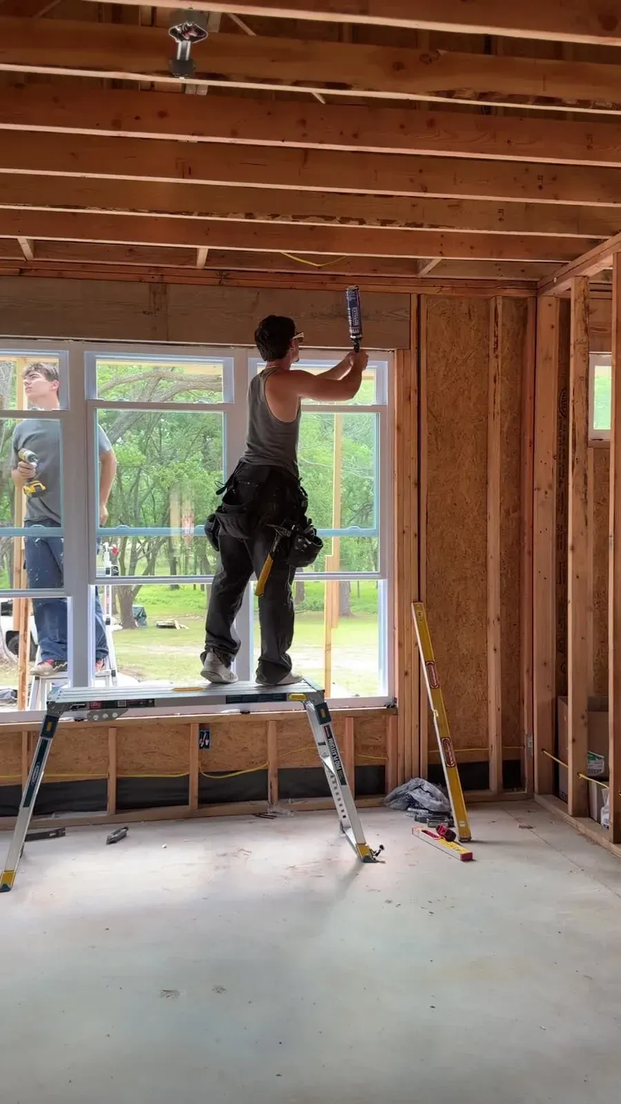 Installer setting new windows in a new-construction home in Oklahoma