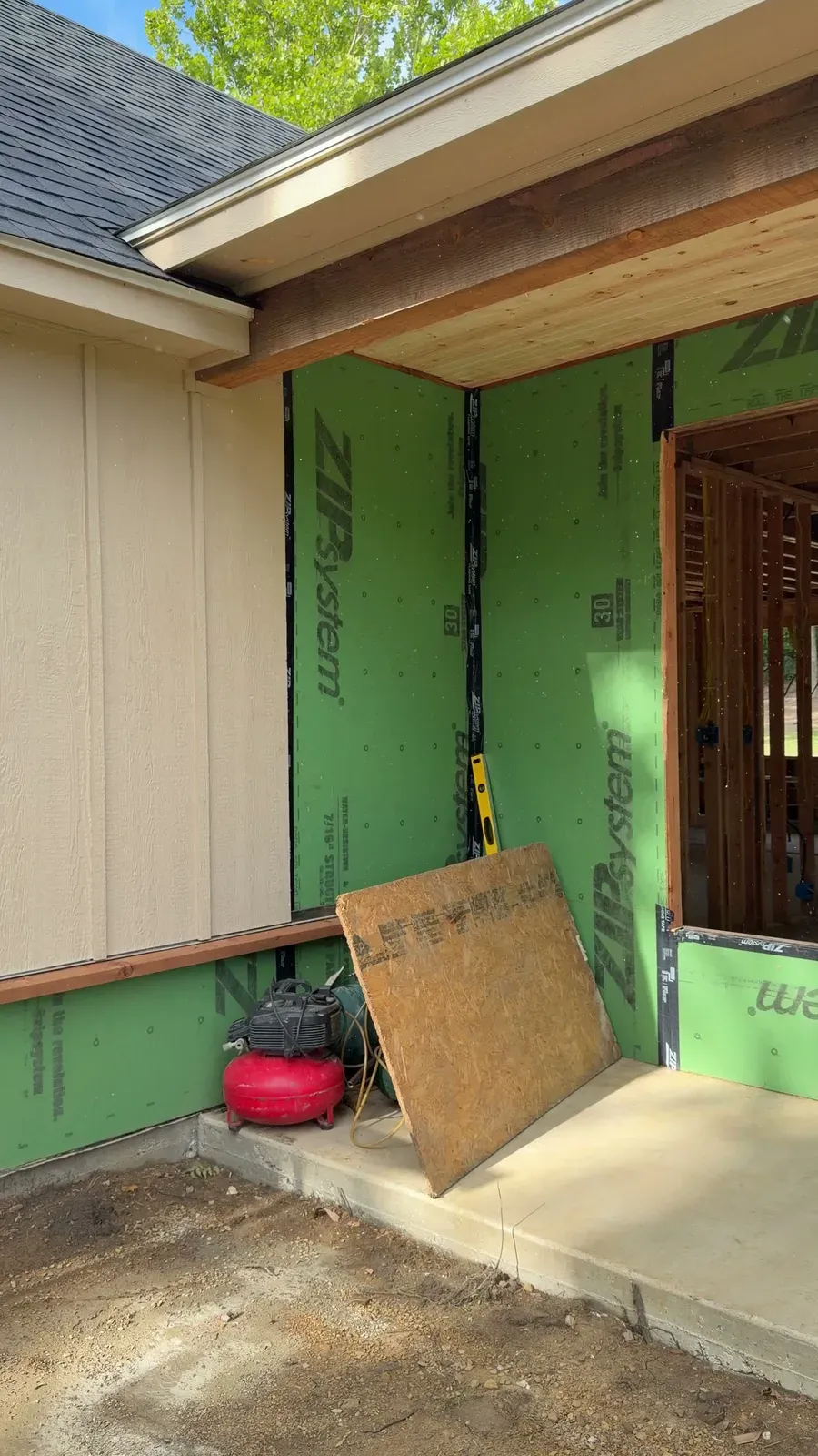 New siding going up over taped ZIP System sheathing